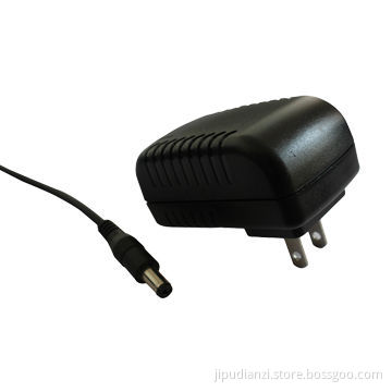 AC/DC power adapter with interchangeable plugs, suitable for all countries